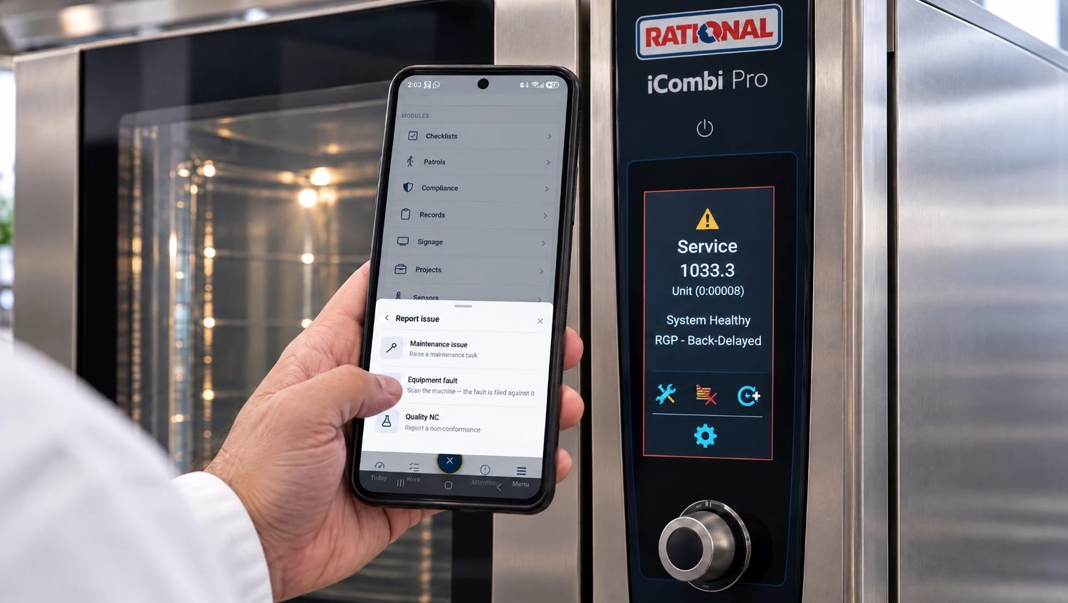 The report issue sheet on the phone in front of the oven